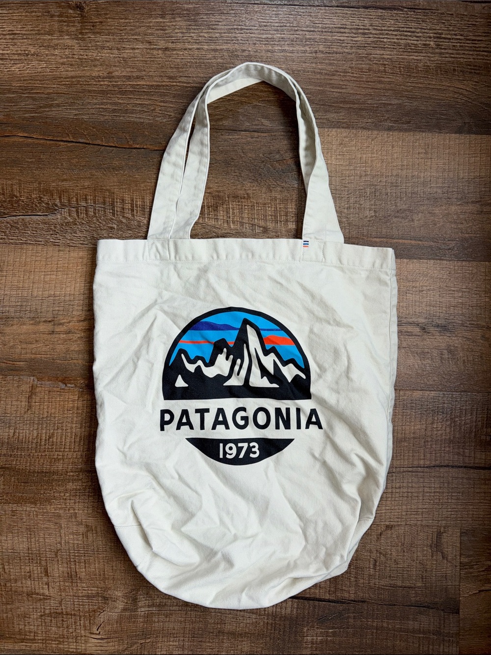 Patagonia Cream Canvas Tote with Blue and Orange Mountain Logo